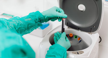 latex gloves removing samples in test tubes  from centrifuge