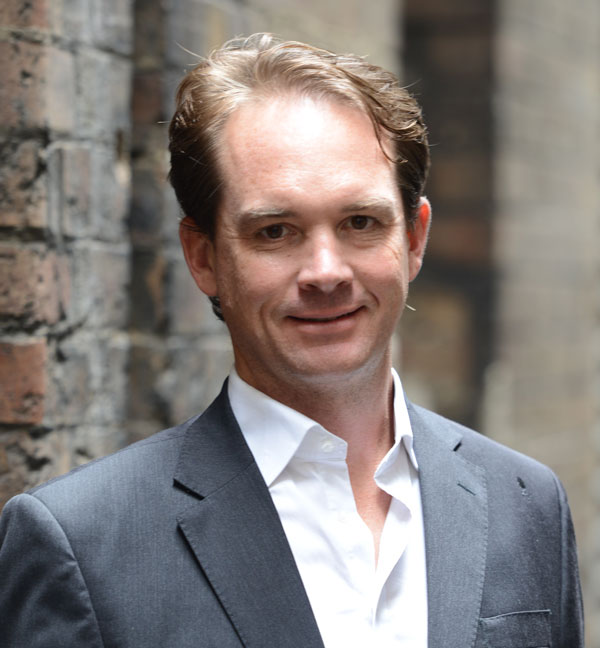 Young man in a grey suit and white shirt